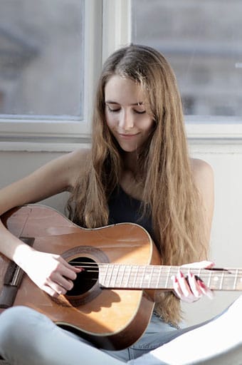 girl playing guitar