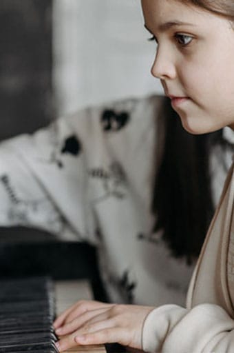 girl playing piano