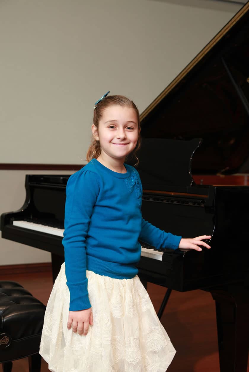 student on piano